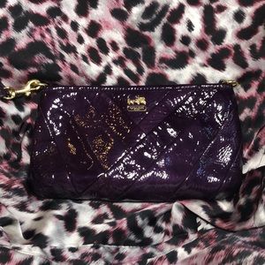 Purple patent leather Coach clutch.